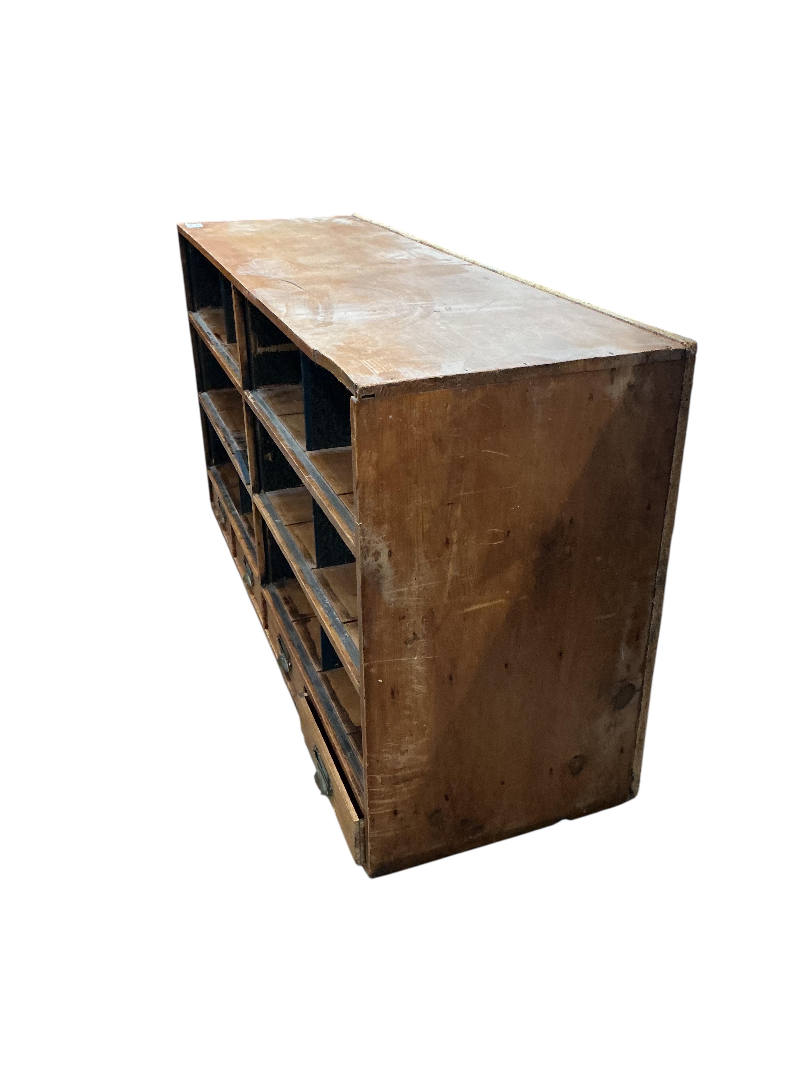 A mid century pine pigeonhole unit, width 121cm, depth 39cm, height 85cm